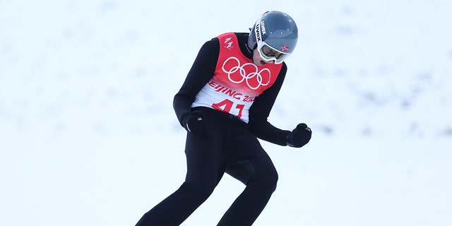 Норвешки репрезентативац Јарл Магнус Ребер слави такмичење током 11. дана Зимских олимпијских игара у Пекингу 2022. у Националном центру за скијашко трчање 15. фебруара 2022. у Зхангјиакоуу у Кини. 